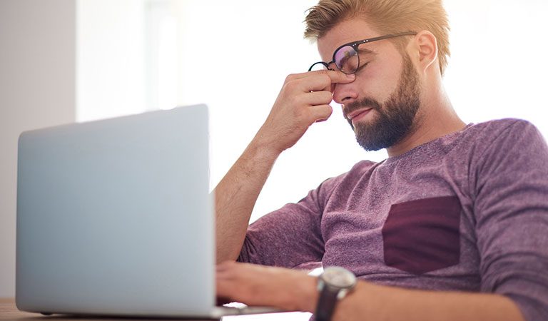 stressed_out_man_laptop_headache